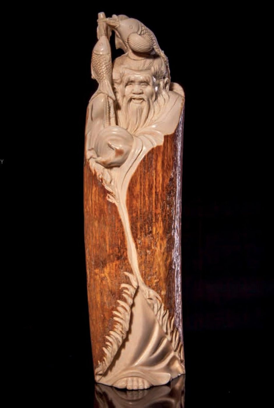 Ivory Tusk Carving of an Old Man — Unknown